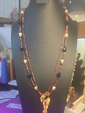 Artisan Brown Beaded Necklace with Decorative Pendant
